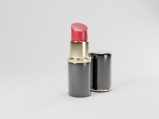 Red lipstick in a black and gold case